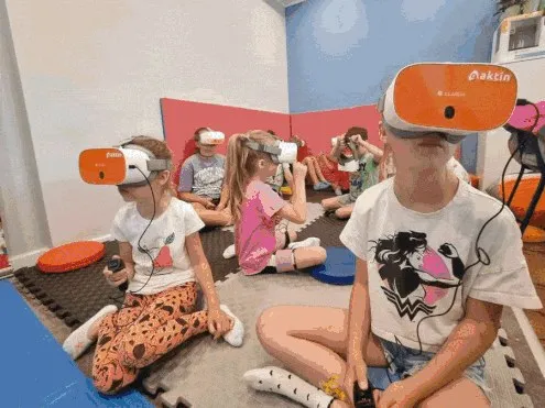 Children trying VR headsets together